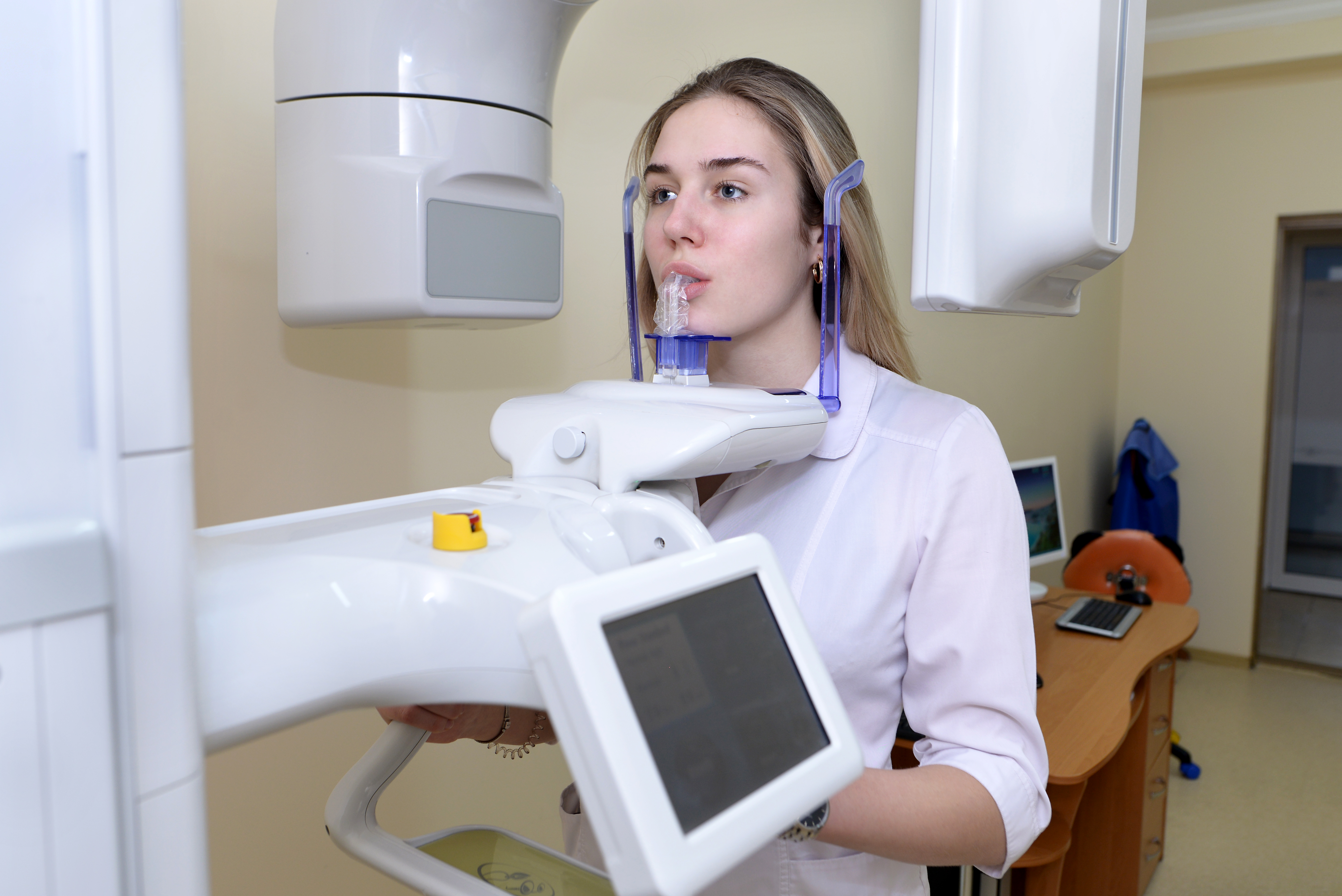 The dentist makes a panoramic digital xray of the teeth of the patient medicine dentistry and healthcare concept…