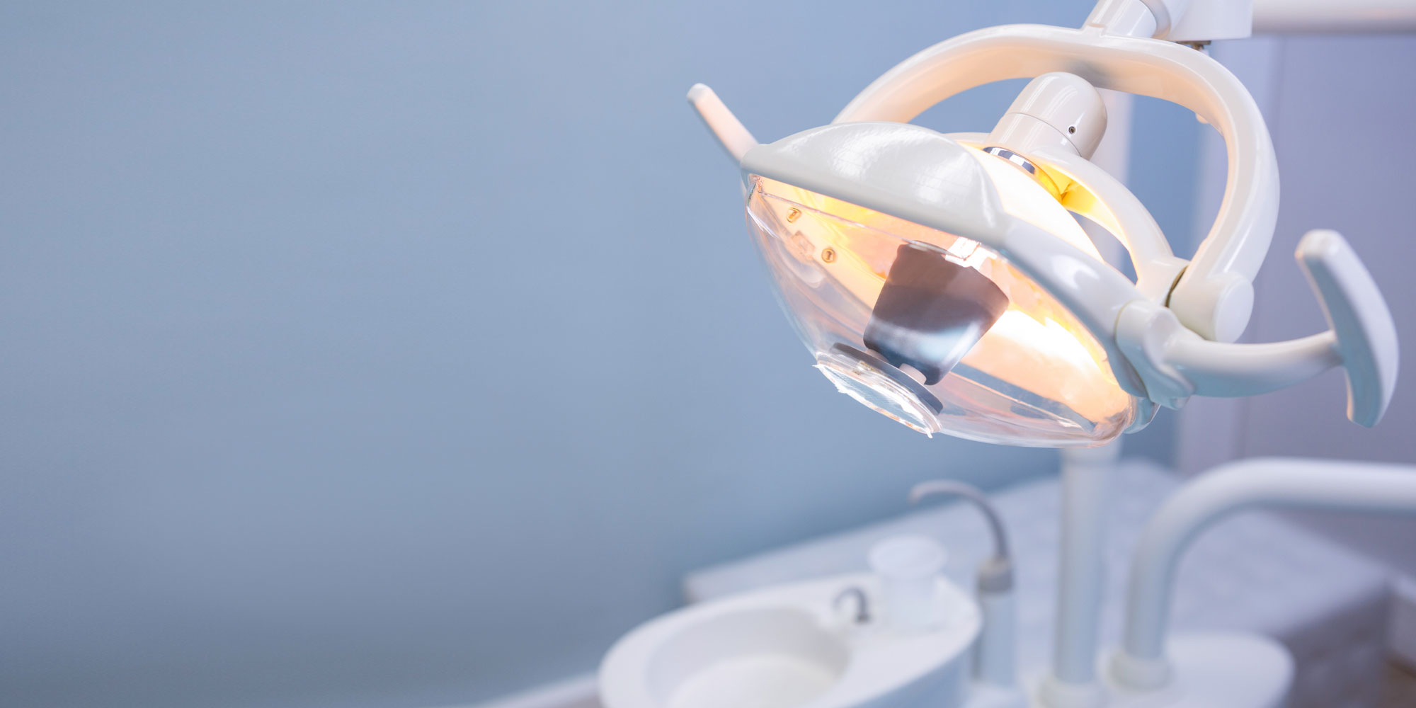 An operatory light above a dental treatment chair