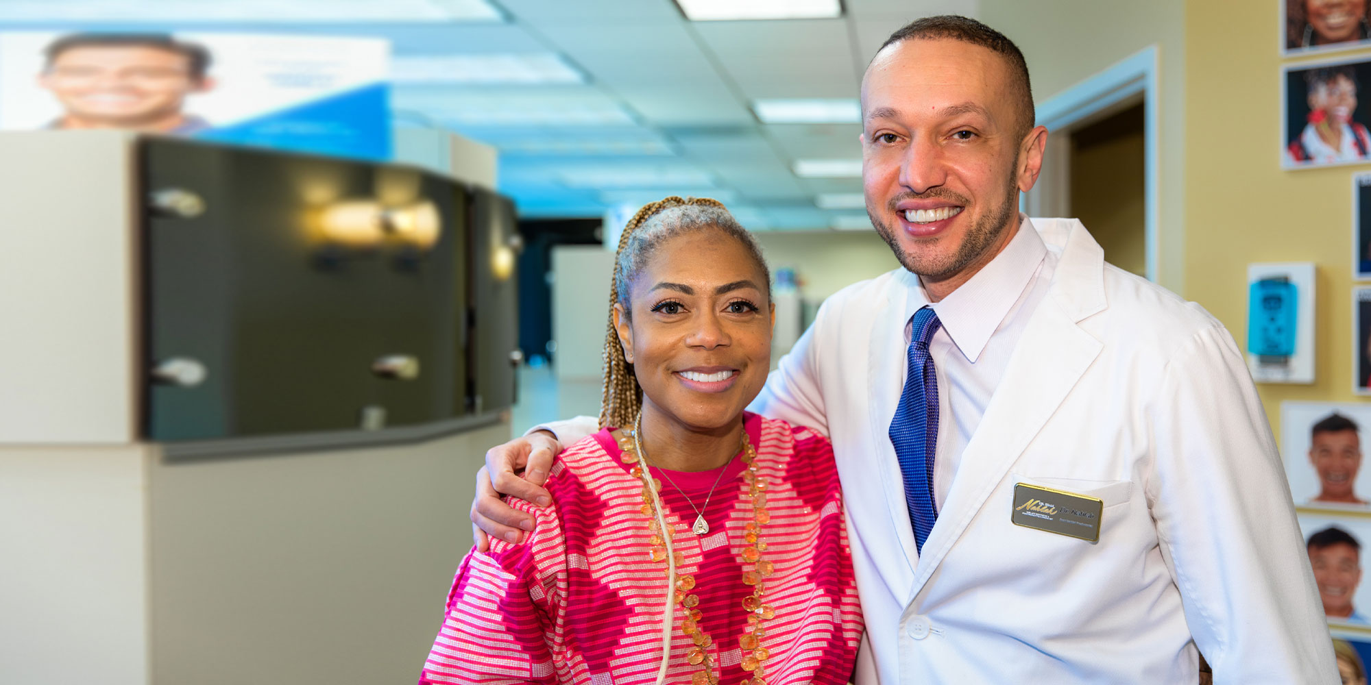 Dr. Nahlah with a patient at the practice
