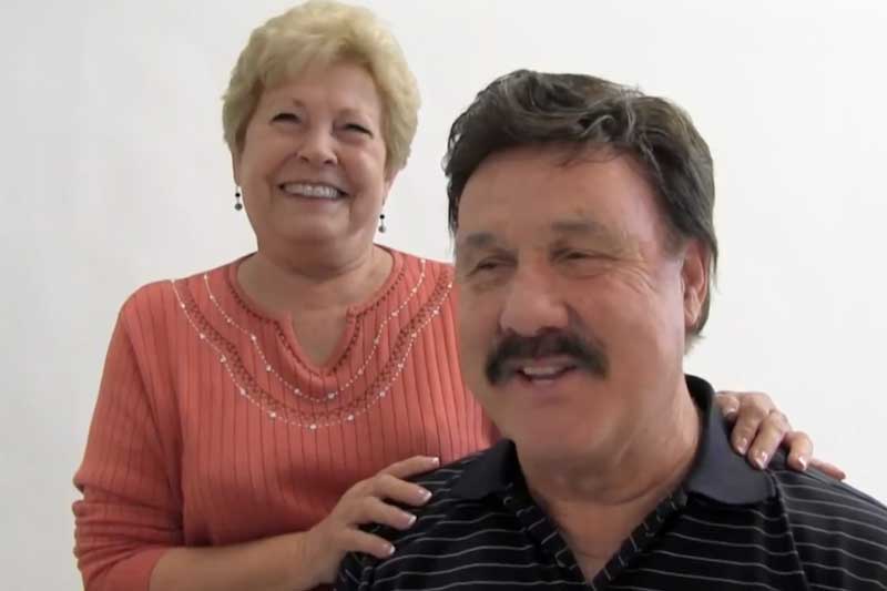 A smiling couple at the practice
