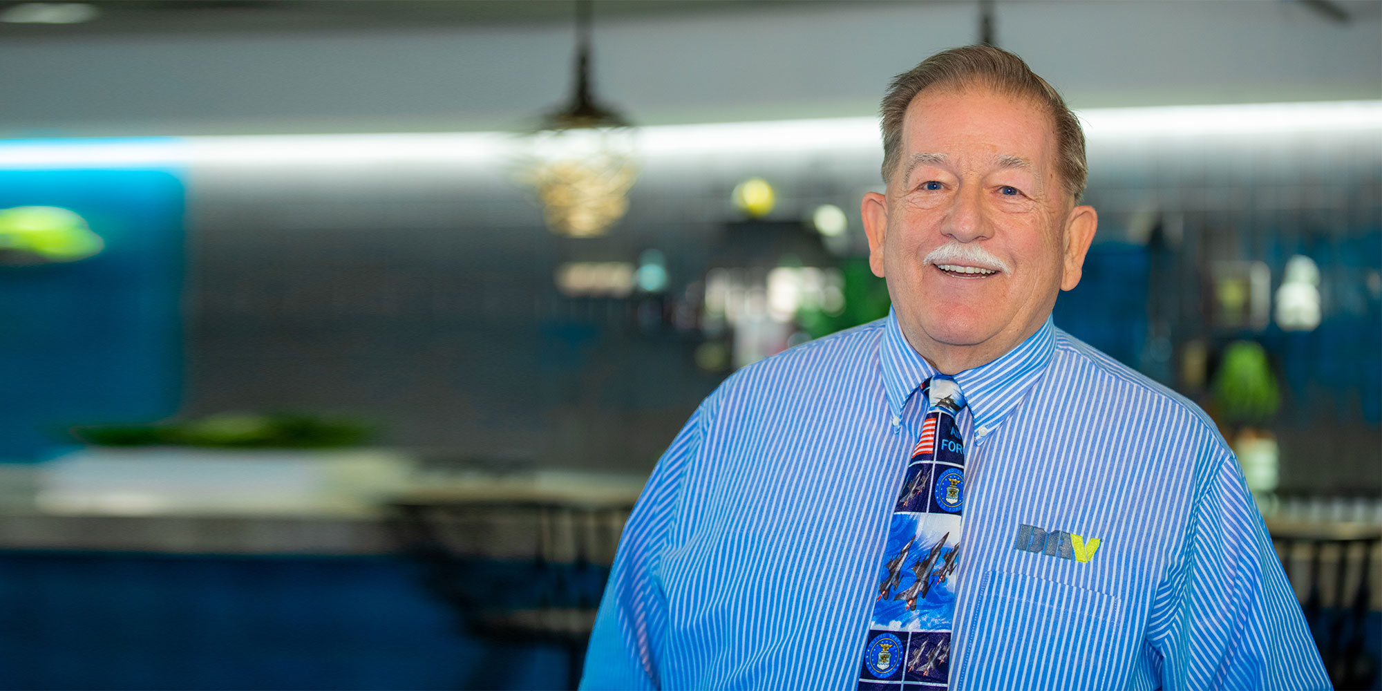 A smiling patient in the practice lounge