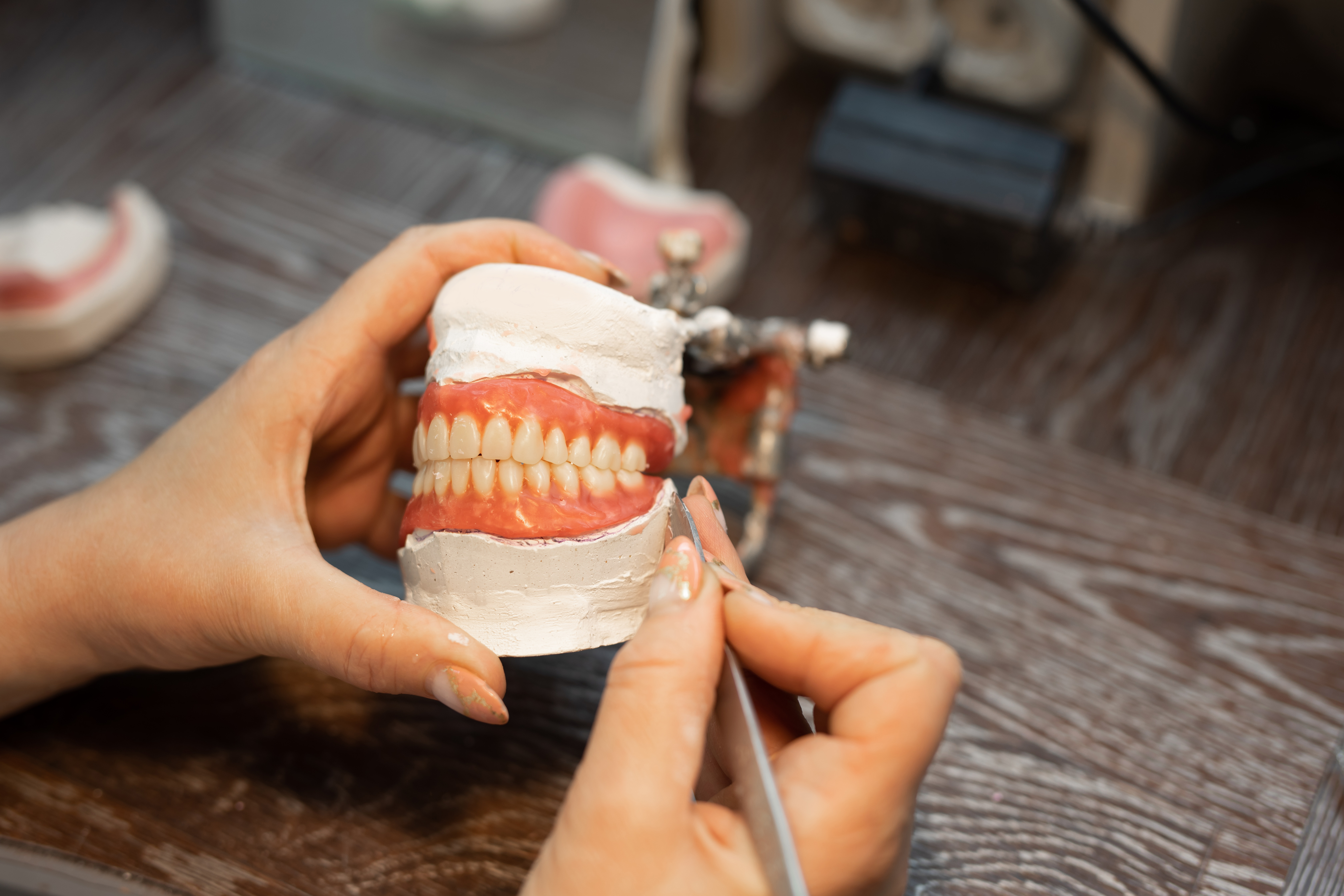 Making a denture in the hands of an orthodontist