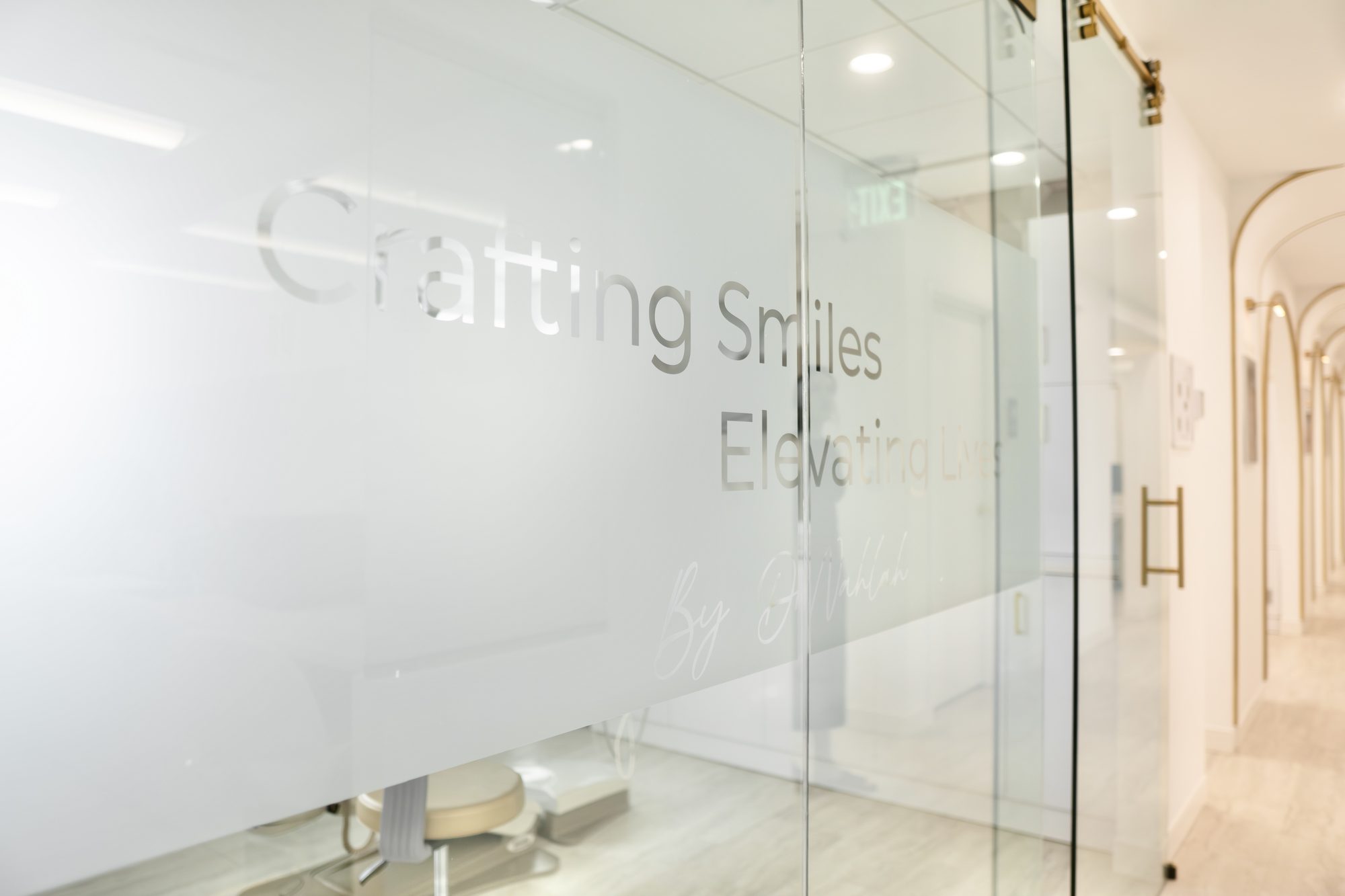 The frosted glass entrance to the treatment area at Dr. Nahlah's Alexandria office