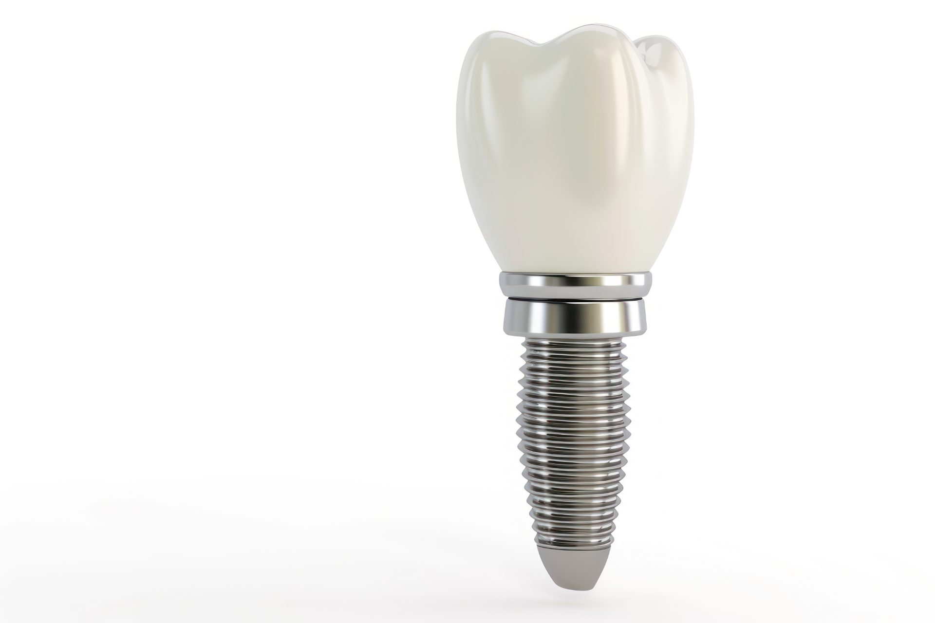 Single dental implant with a titanium post, abutment and white crown on a plain white background